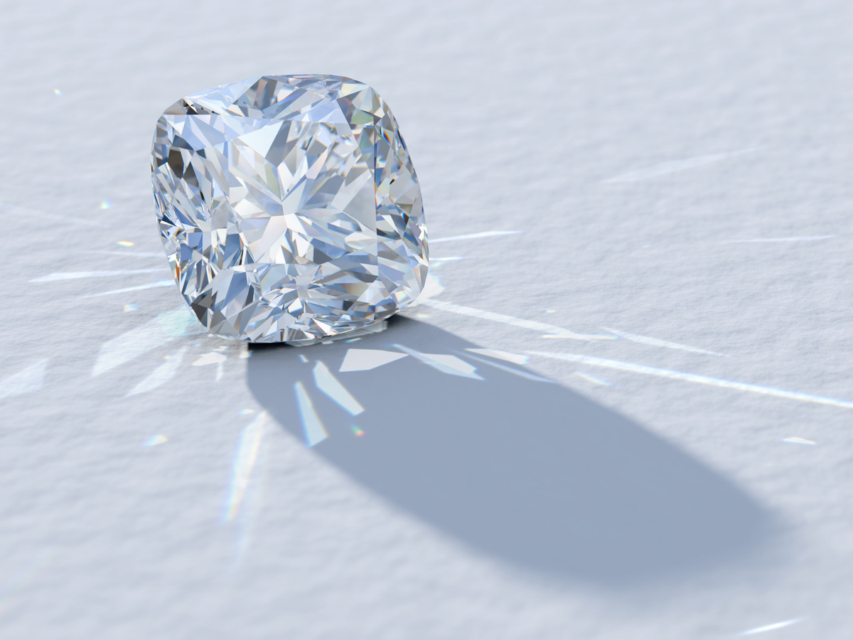 Cushion cut diamond on light blue textured background